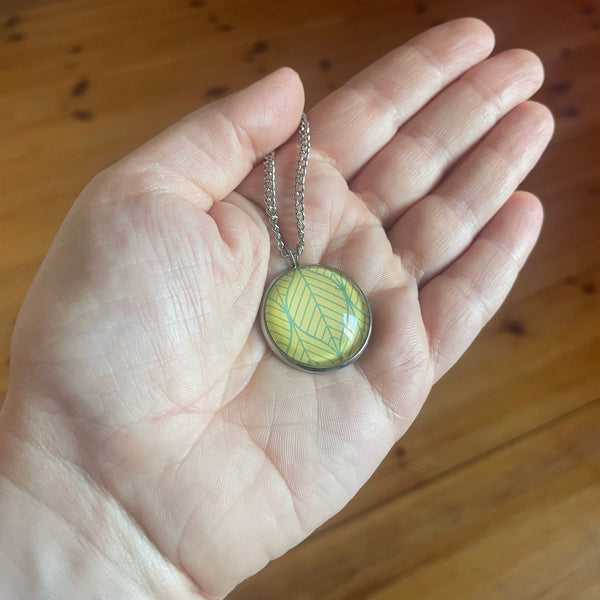 Yellow and Green Leaf Print Glass Cabochon Pendant Necklace
